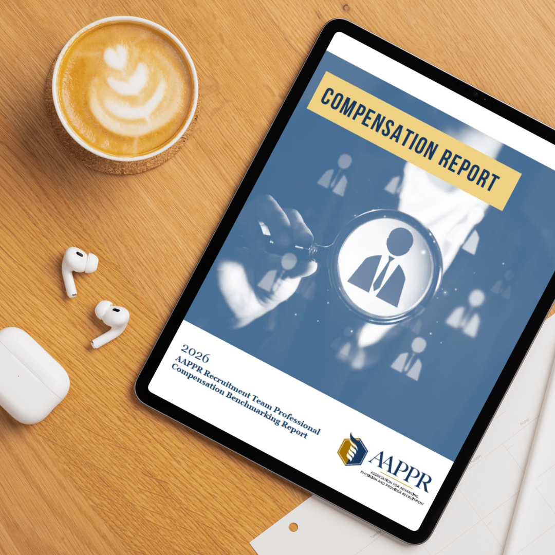Tablet displaying compensation report beside coffee and earbuds